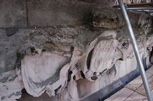 Royal crest and carvings at top of pedestal / base of column of the Monument